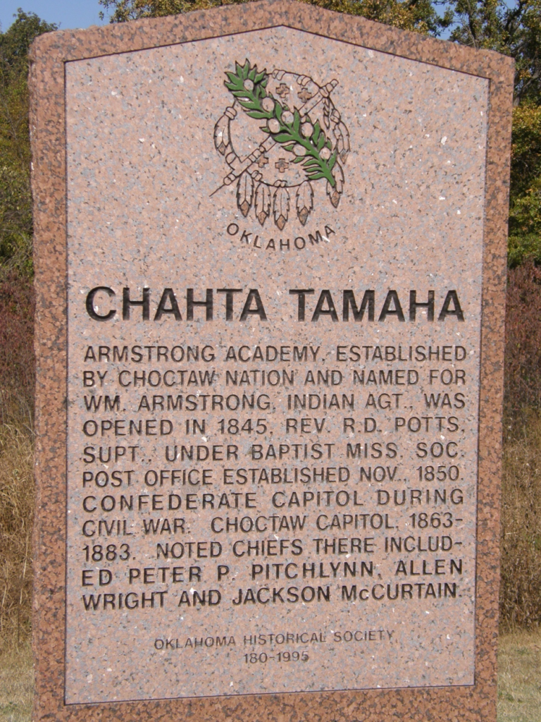 Image of Historical Marker labeled Chahta Tamaha. "Armstrong Academy, established by Choctaw Nation and named for Wm. Armstrong, Indian Agt., was opened in 1845. Rev. R.D. Potts, Supt., under Baptist Miss. Soc. Post Office established Nov. 1850. Confederate Capitol during Civil War. Choctaw Capitol, 1863-1883. Noted chiefs there included Peter P. Pitchlynn, Allen Wright, and Jackson McCurtain. Oklahoma Historical Society 180-1995.