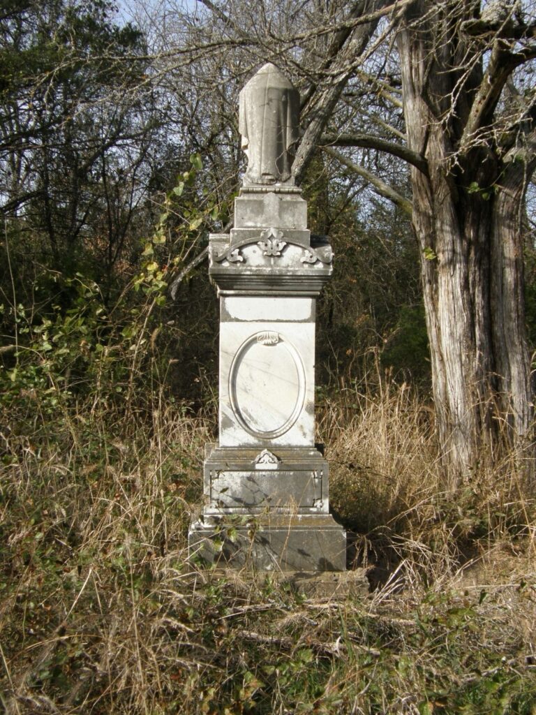 Tall shite monument with no visible inscription.